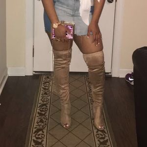 Tan over the knee boots.